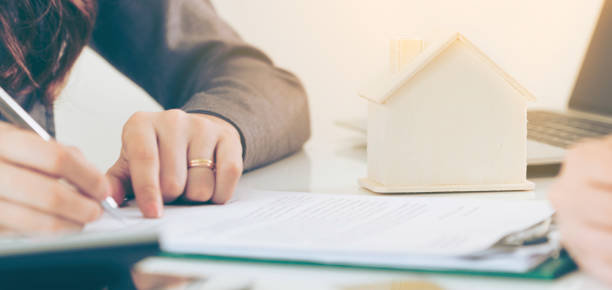 istock Client Signs Document to Buy House and Real Estate 962081146