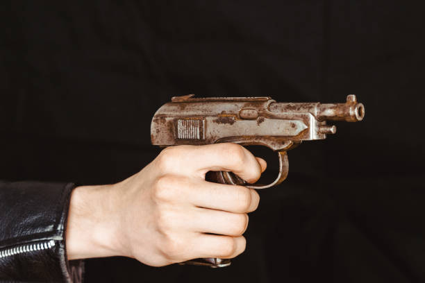 istock the hand holding the gun 962081404