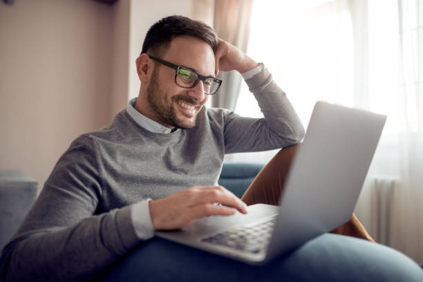 istock Businessman working with laptop at home 962081882