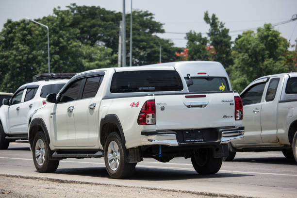 Private Pickup Truck Car New Toyota Hilux Revo  Rocco Chiangmai, Thailand - May 10, 2018: Private Pickup Truck Car New Toyota Hilux Revo  Rocco. On road no.1001, 8 km from Chiangmai city. toyota hilux stock pictures, royalty-free photos & images