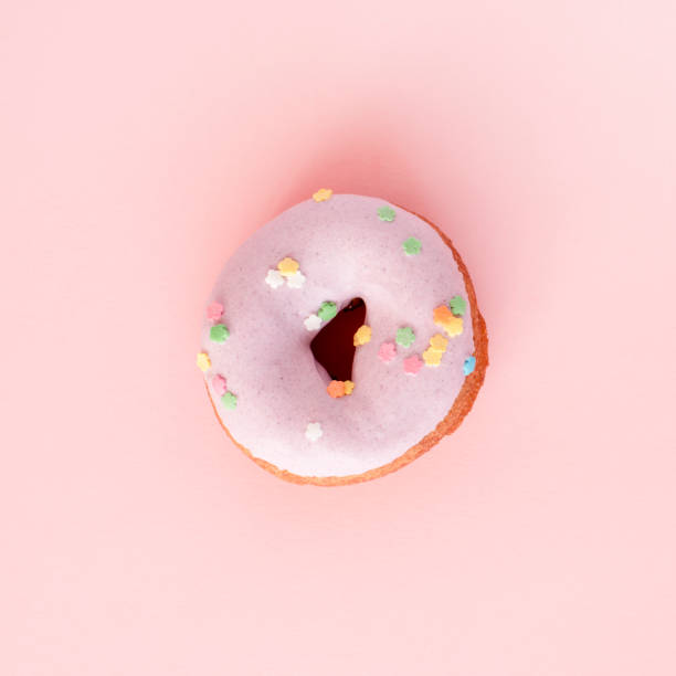 istock A donut covered in purple frosting 962083242