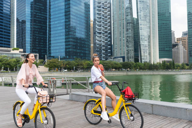 istock Girlfriends biking in the city 962084556