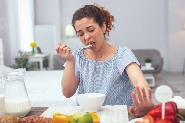 istock Young housewife avoiding eating raw vegetables 962085990