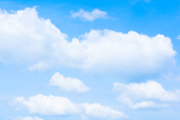 istock Bright white clouds and light blue sky in summer season. Thailand. Copy space. 962086398