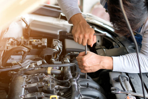 istock Auto mechanic working in garage. Repair service. 962090076