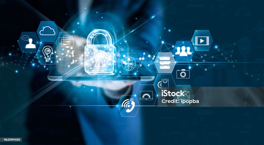 Data protection privacy concept. GDPR. EU. Cyber security network. Business man protecting data personal information on tablet. Padlock icon and internet technology networking connection on digital dark blue background. Security Stock Photo