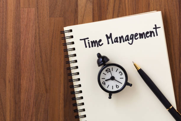 istock Time management on wooden table background 962094686