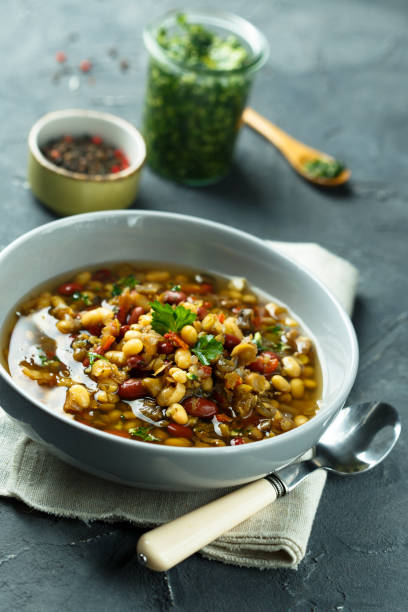 istock Lentils and vegetables soup with pesto sauce 962094890