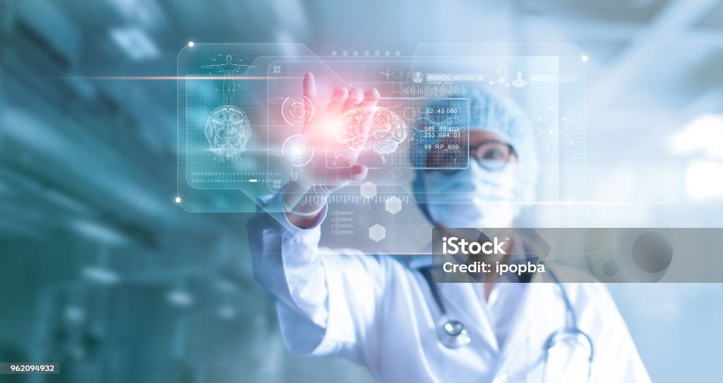 Doctor, surgeon analyzing patient brain testing result and human anatomy on technological digital futuristic virtual computer interface, digital holographic, innovative in science and medicine concept Healthcare And Medicine Stock Photo