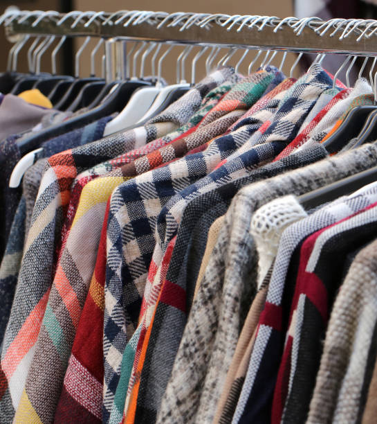 istock Many clothes in the hangers in a flea market 962096652