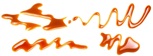 istock Caramel splashes isolated on white background. Spilled caramel sauce, toffee toppings 962100292