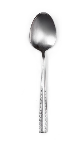 Steel tablespoon. Dinning silver spoon isolated on white background. Kitchen utensils concept, close up