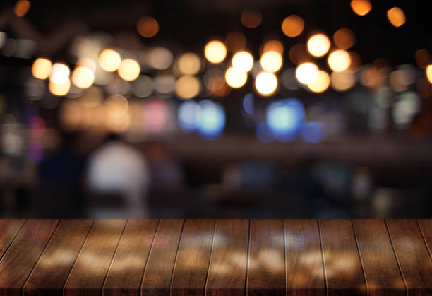 istock Wooden board empty table  cafe, coffee shop, bar blurred background can be used for display or montage your products and Mock up 962101982