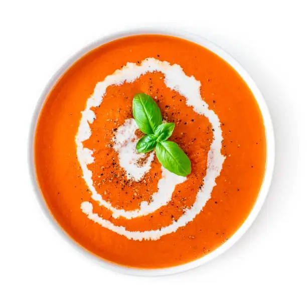 Tomato soup in a white bowl isolated on white background. Top view. Copy space. Traditional cold gazpacho soup. Spanish cusine"n