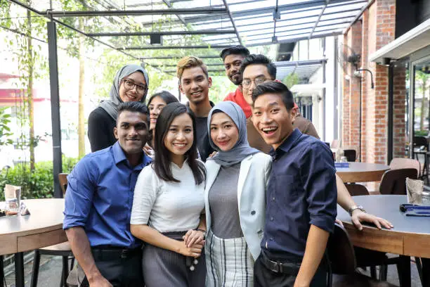 Young Asian man woman group portrait colleague student friend family