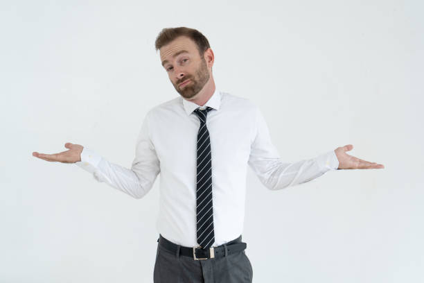 istock Doubtful business man shrugging shoulders, throwing up hands 962107270