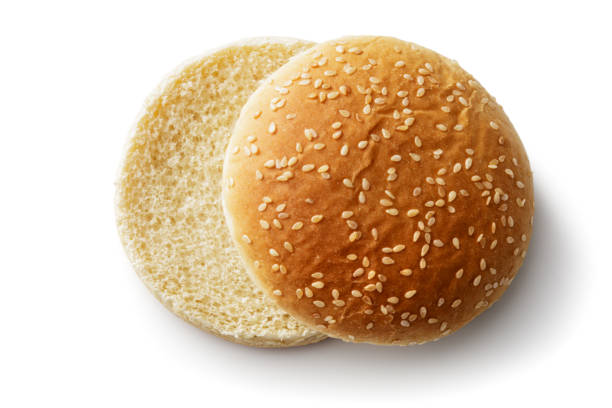 Bread: Hamburger Bun Isolated on White Background Bread: Hamburger Bun Isolated on White Background burger bun stock pictures, royalty-free photos & images