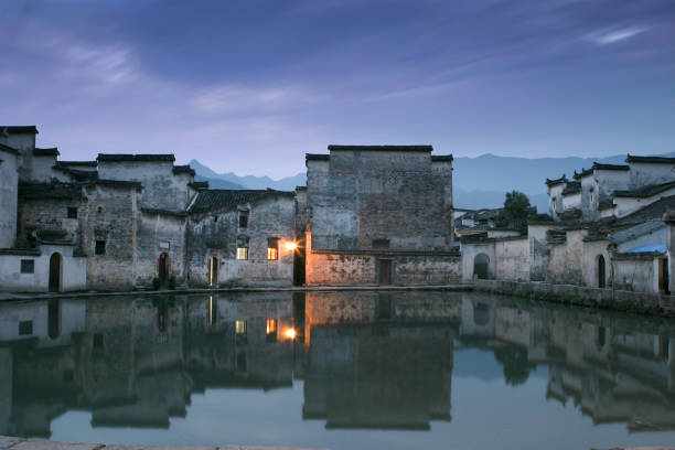 istock Pond with ancient buildings reflection in Hong Cun, Anhui, China 962111820