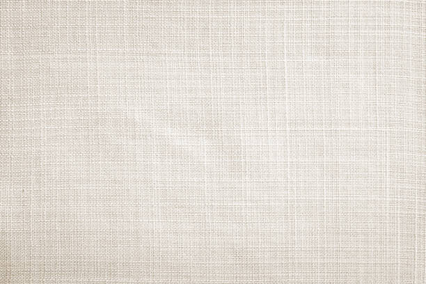 Light cream fabric texture background Light cream linen fabric texture wallpaper background canvas fabric stock pictures, royalty-free photos & images
