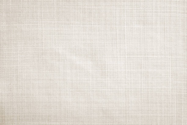 Light cream fabric texture background Light cream linen fabric texture wallpaper background linen stock pictures, royalty-free photos & images