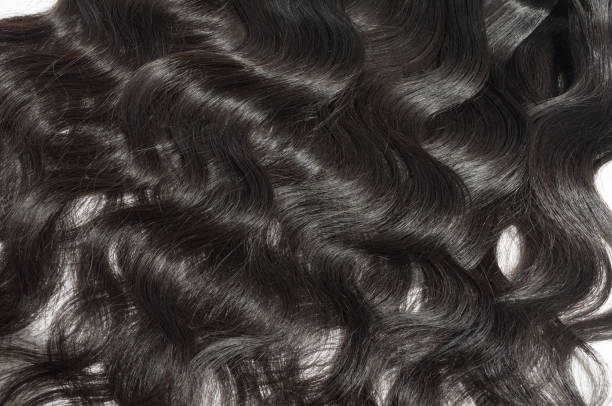 istock unfolded virgin remy body wavy black human hair weave extensions 962113894