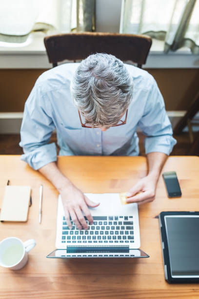 istock Man paying online with a credit card 962114478