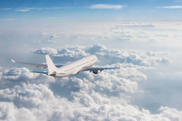 Photo of Airplane flying over cloudy sky