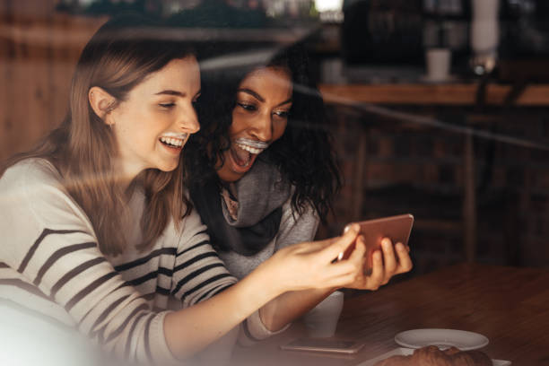 istock Friends in a cafe taking a selfie 962119412