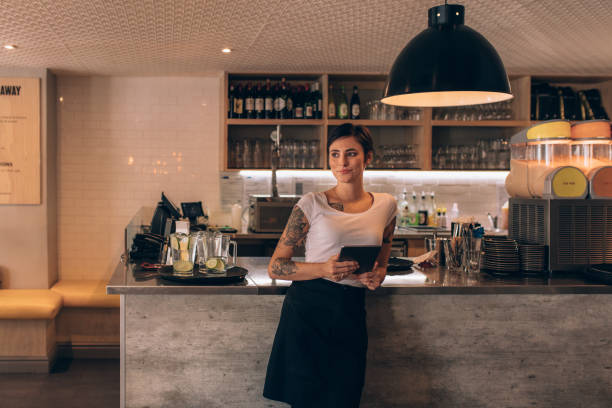istock Cafe owner standing at the counter 962123066