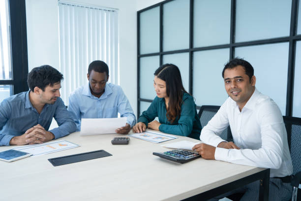 istock Multiracial business team of four having brainstorming session 962126358