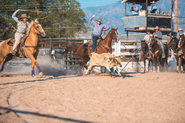 istock Cowboys lassoing in rodeo arena 962127044