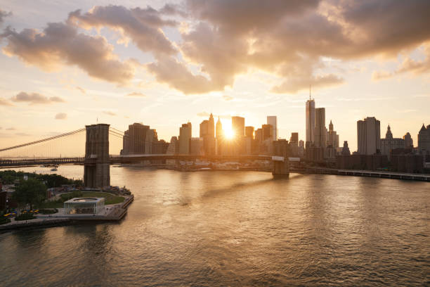 istock New-York skyline and Brooklyn bridge at sunset 962127954