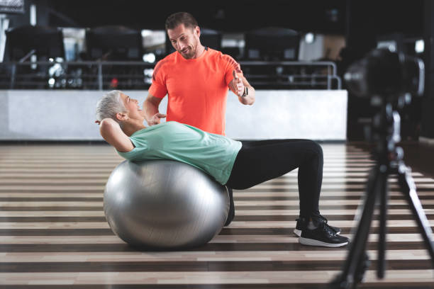 istock Senior woman exercising at the gym 962128240