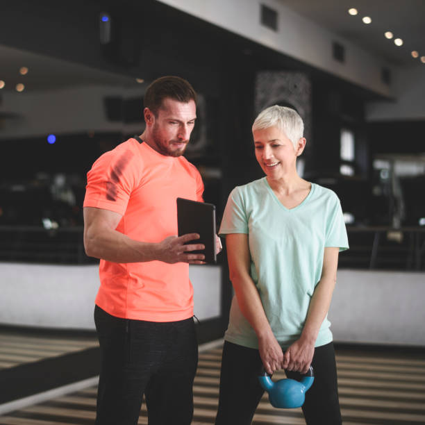 istock Senior woman exercising at the gym 962128242