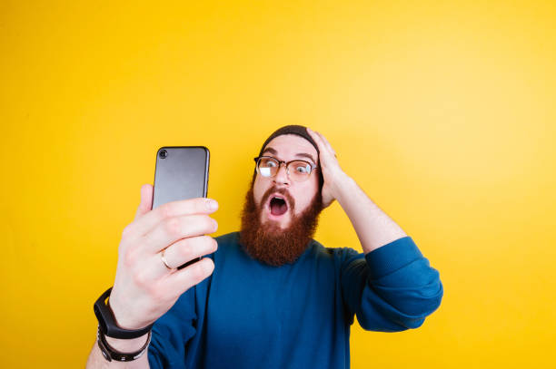 istock Shocked bearded man checking his phone 962135212