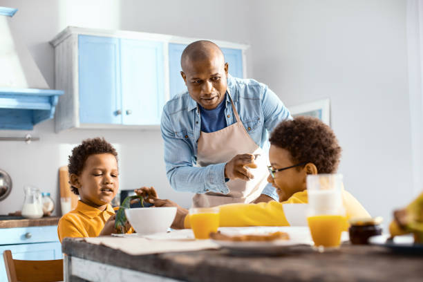 istock Pleasant young father asking son to act calmer 962136598