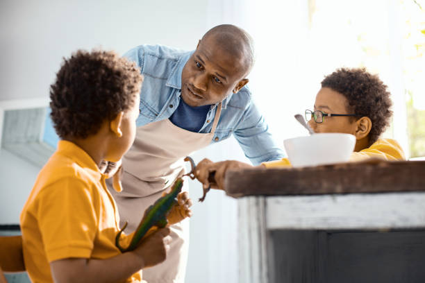 istock Loving young father asking his sons to behave themselves 962136882