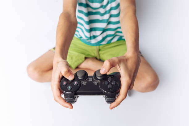 istock The image of hands that play games, stick, white background, insert text , advertising, 962145544
