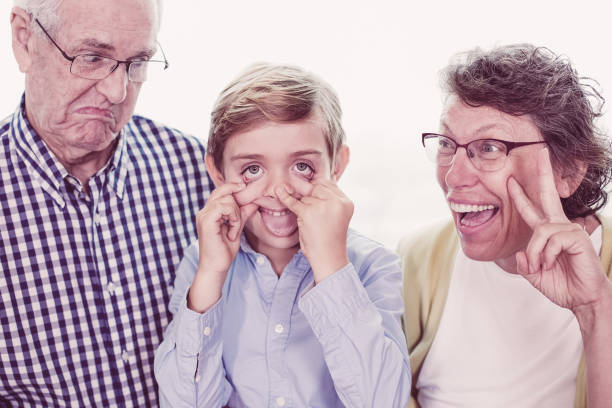 istock Playful Grandparents and Grandson Making Faces 962147132