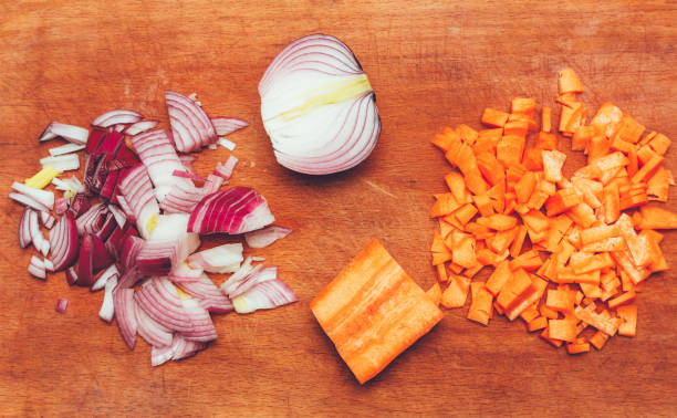 istock sliced onions and carrots on the cutting board top view 962152538