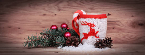 istock Christmas Cup and fir branch on wooden background 962155672