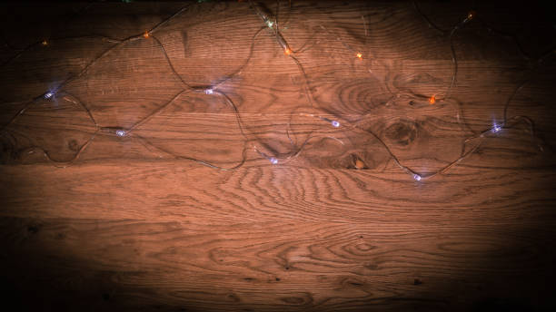 istock Christmas tree garland laid out on a wooden table 962155762