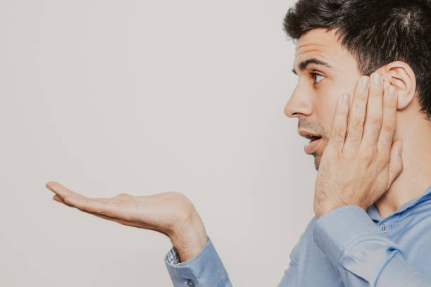 istock Admiring Young Man Holding Copy Space on Palm 962156562
