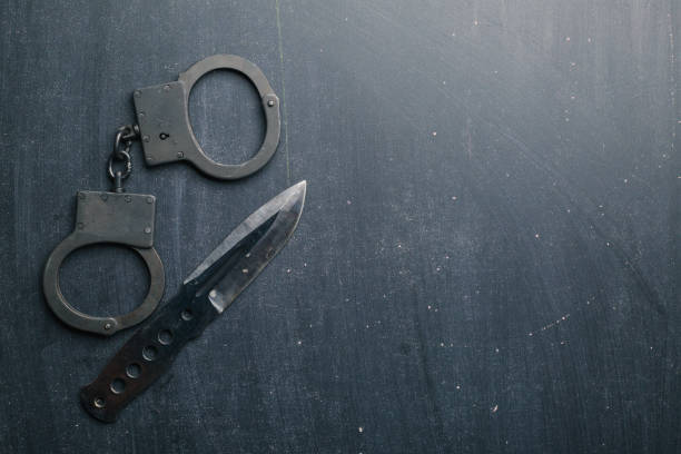 istock set of knife and handcuff 962156952