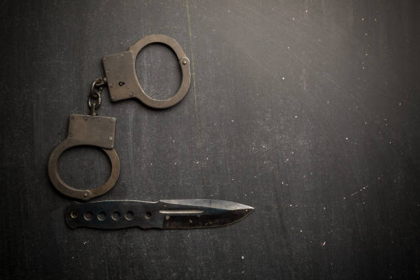 istock set of knife and handcuff 962157018