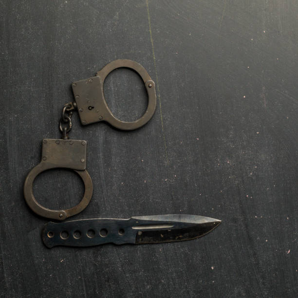 istock set of knife and handcuff 962157060