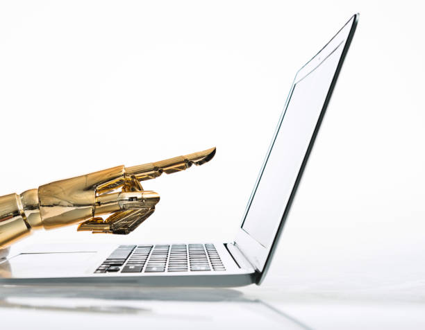istock Robot's finger pointing to computer monitor 962160964