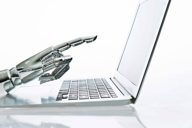 istock Robot's finger pointing to computer monitor 962161062
