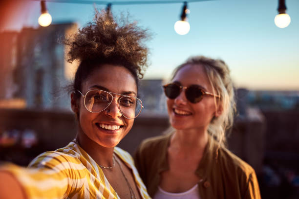 istock Two women taking selfie at the party. 962161558
