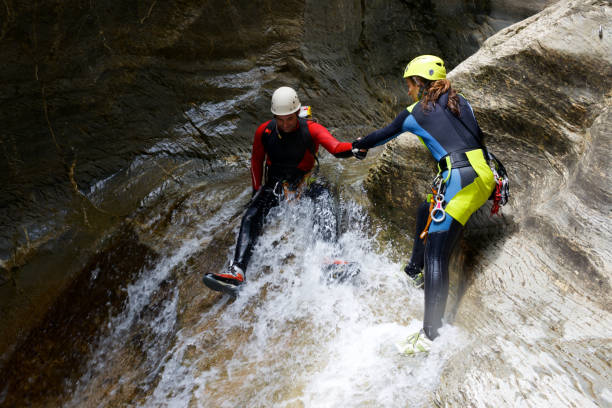 Canyoneering in Spain Canyoning in Gorgol Canyon, Tena Valley, Pyrenees, Huesca Province, Aragon, Spain. neoprene photos stock pictures, royalty-free photos & images